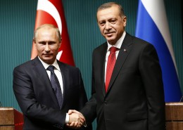 Russia's President Putin shakes hands with Turkey's President Erdogan after a news conference at the Presidential Palace in Ankara